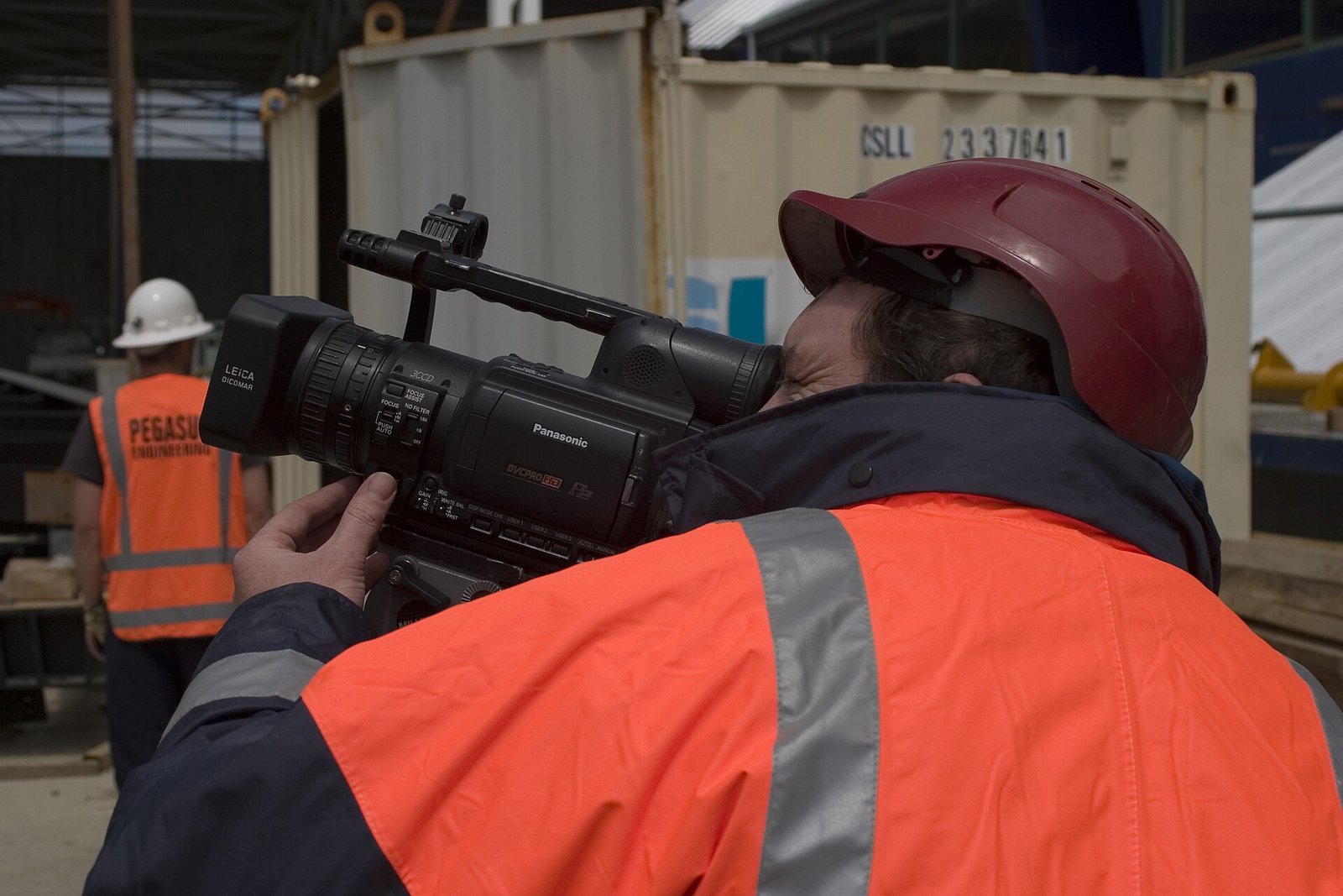 Camera Operator At Construction Site