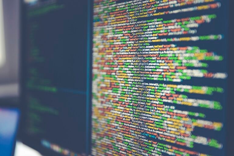 Code on computer monitor (Unsplash)
